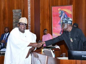 President Bola Tinubu and Professor Tunji Olaopa.jpg
