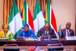 President Bola Tinubu, second left, President Ramaphosa, second right, Minister RO Lamola right and Bianca Ojukuwu, left.jpg