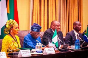 President Bola Tinubu, second left, President Ramaphosa, second right and Bianca Ojukuwu, left.jpg