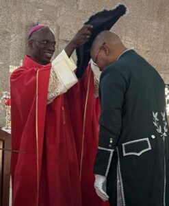 Prince Julius Adelusi-Adeluyi receiving the Knighthood from Bishop of the Catholic Diocese of Ekiti, Fr Felix Femi Ajakaiye who represented the Pope.jpg
