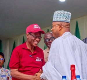 Daniel Ozigi, left, and Governor Usman Ododo