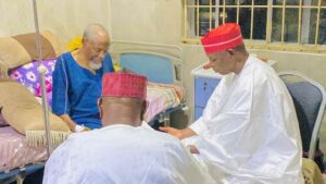 Engr. Bunkere on sick bed with Governor Yusuf.jpg
