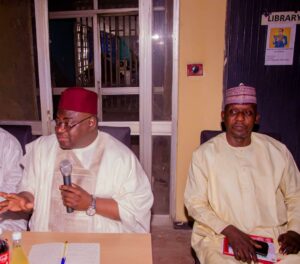 Hon. Waiya, in red cap, during the meeting