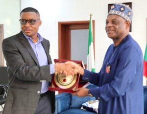 Governor Bassey Otu of Cross Rivers State presenting a souvenir to the Executive Secretary of TETFUND, Architect Sonny Echono, during a courtesy call at the Government House Calabar.