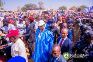 Governor within a crowd during the flagging off the road construction