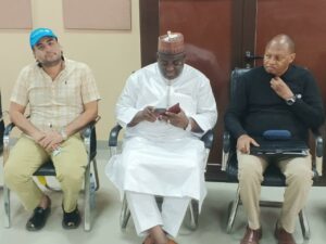 Waiya flanked by UNICEF officials