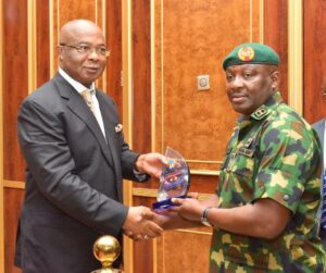 Imo State Governor, Senator Hope Uzodimma, receives a plaque from the General Officer Commanding 82 Division of the Nigerian Army/Commander, Joint Taskforce South East Operation Udoka, Maj. Gen. Oluyemi T Olatoye who paid the Governor a working visit at the New Exco Chamber, Government House, Owerri.... Tuesday.