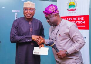 Governor Oyebanji receiving his nomination letter from Vanguard's Adekunle Adekoya