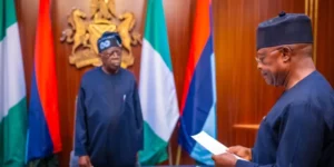 President Tinubu, left, swearin in Rivers Adminitrator, Ibas
