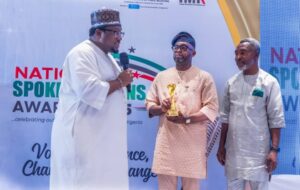 Mr Olufemi Soneye, centre, receiving his award