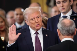 U.S. President Donald Trump takes the oath of office on the day of his Presidential Inauguration at the Rotunda of the U.S. Capitol on January 20, 2025. Kevin Lamarque/REUTERS