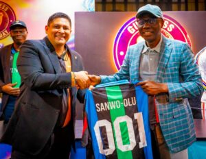 L-R: Managing Director/CEO, Guinness Nigeria Plc, Girish Sharma presenting a jersey to Governor of Lagos State, Mr. Babajide Sanwo-Olu, during a courtesy visit and an official presentation of the English Premier League Trophy to the Governor at Lagos House, Marina on Sunday, May 18, 2025.