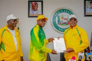 From righ, Governor Dapo Abiodun, Chief Segun Odegbami and another official