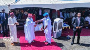 Mr. Banda receiving an Award presented to UNICEF by Gov Abba Kabir Yusuf at the event
