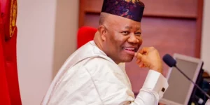 Senate President Godswill Akpabio glove