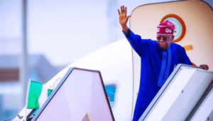 President Tinub waving
