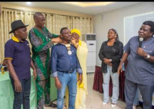 Incoming President of Rotary Club of Ikeja-Alausa Central, Rotarian Moses Oyelami being decorated at the handover ceremony