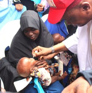 The Deputy Governor immunizing a child in Bunkure