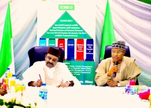 L-R: Hon. Minister of Transportation, Senator Said Ahmed Alkali, noting the request his quest, the Governor of Kaduna state Senator Uba Sani, was making to enable him to respond to the Governor.
