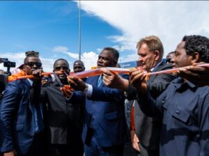 Liberia’s Vice President, Jeremiah Koung, centre, cutting the tape to declare open night marine operations at the Free Port of Monrovia last Thursday 