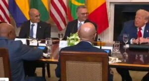 President Trump, right, facing President Boakai, left, in Washington yesterday