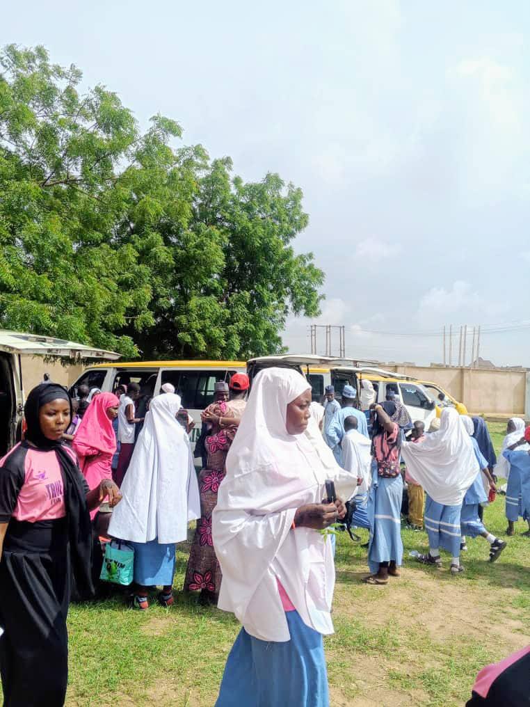 The students boarding vehicles to their respective states