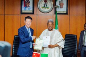 Chinese Ambassador to Nigeria, Mr Yu Dunhai (left), and Minister of Budget and Economic Planning, Senator Abubakar Bagudu, during the signing of an Exchange of Notes on the Chinese government's $1 million relief support for flood victims in the North in Abuja on Wednesday, 27/08/25. PHOTO: FMBEP
