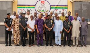 Kogi CP, Miller Dantawaye, in a group photograph with journalists