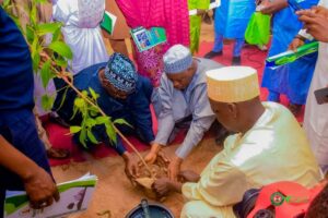 The SSG, Bala Ibrahim, who represented Governor Namadi demonstrating the tree planting campaign
