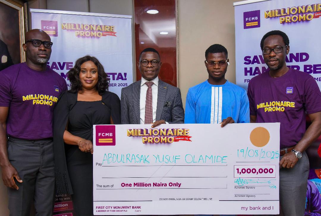 Divisional Head, Personal Banking, First City Monument Bank (FCMB), Mr. Adetunji Lamidi, presenting a cheque to Mr. AbdulRasak Yusuf, one of the winners of ₦1 million in the sixth draw of the FCMB Millionaire Promo Season 10 at a ceremony in Lagos recently