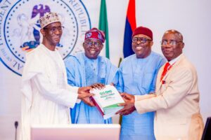 President Tinubu receiving the report of the Presidential Committee on the Ogoni Consultations, chaired by Professor Don Baridam (right). With him are Nuhu Ribadeu, left, and Go Fubara