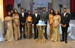 An old student turned lawyer and some graduating students and graduation cake