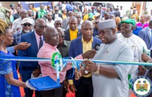 President Bio cutting the tape opening new Sewa market. On his immediate right is NASSIT DG, Fouad Daboh, on the far right is project consultant, Abel Onomake 