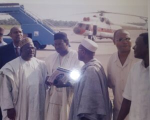 Former Nigerian High Commissioner to Sierra Leone, Amb Polycap, extreme left, discussing with Nigerian diplomats, with Chief Tony in the middle, on strategies to lift military personnel at Lungi Int Airport. The helicopter at the background