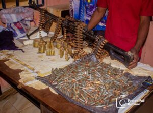 The recovered cache of arms and arrested gunrunners