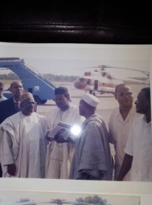 Former Nigerian High Commissioner to Sierra Leone, Amb Polycap, extreme left, discussing with Nigerian diplomats, with Chief Tony in the middle, on strategies to lift military personnel at Lungi Int Airport. The helicopter at the background