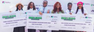 L – R: Second runner-up, Chizaram Ekueme of Awesome College; Head, Brand Management, Fidelity Bank Plc, Cynthia Ogbonna; Winner, Chizaram Unachukwu of Cedec International School; Broadcaster and Communications Expert, Wemimo Adewuni; First runner-up, Nwatu Chidera of Brookstones and Best Brains International School; and Head, Women Banking, Fidelity Bank Plc, Harriba Harry-Pepple; at the maiden edition of the Fidelity Bank She Leads debate competition held in commemoration of the 2025 International Day of the Girl Child in Lagos recently.