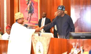 President Bola Tinubu congratulating the new INEC Chairman, Professor Joash Amupitan