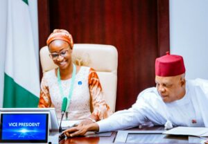 Joy Ogah takes over VP seat as one-day vice president. With her is Shettima