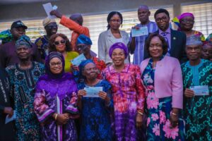 Some of the retiree showing their cheques