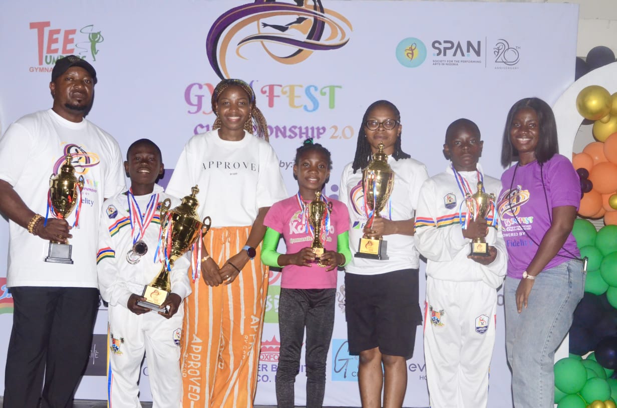 L-R: Head Coach, Tee Tumblers Gymnastics Club & Lagos State Gymnastics Club, Patrick Umoh; CEO, Tee Tumblers Gymnastics Club and Co-founder, Gymfest Championship 2.0, Yoyin Akpose; Creative Coach, Gymfest Championship 2.0, Oyegbata Chinedu; and Gymfest Program Coordinator, Faith Oaikhiena; flanked by some participants during the Gymfest Championship 2.0 sponsored by Fidelity Bank Plc and held in Lagos, recently.