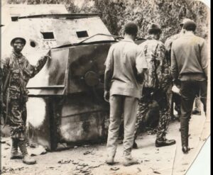 Journalists including Ajayi Memaiyetan (extreme right) inspecting the “Red Devil” homemade Armor vehicle used by the Biafra troops to capture the Midwest and Ore.