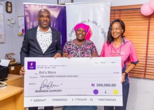 L-R; Rasheed Bolarinwa Head, Brand Manager & Corporate Communications , Mary Enigbokan ( one of the beneficiaries), Mrs Ebun Anozie, CEO C.O.P.E during the launching of the Adopt a Survivor Breast Cancer Support Initiative by Polaris Bank in Lagos recently