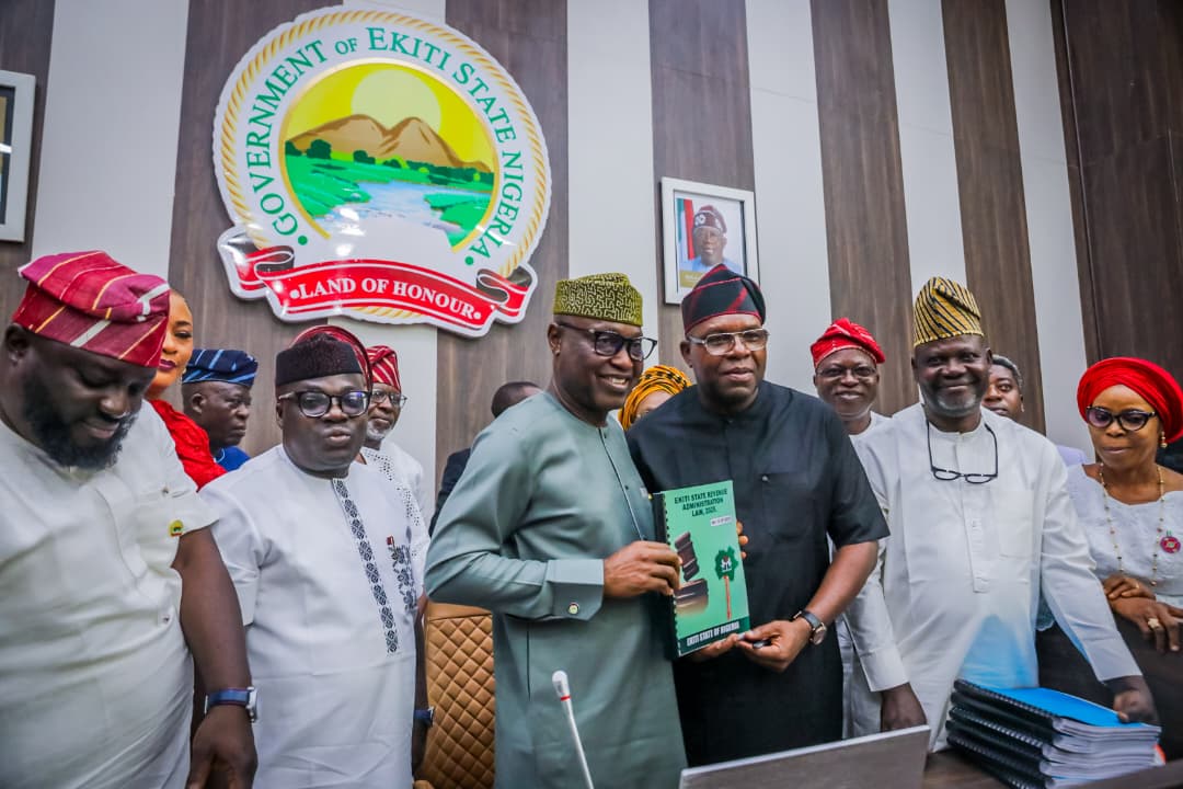 Governor Oyebanji holdng a copy of thye document