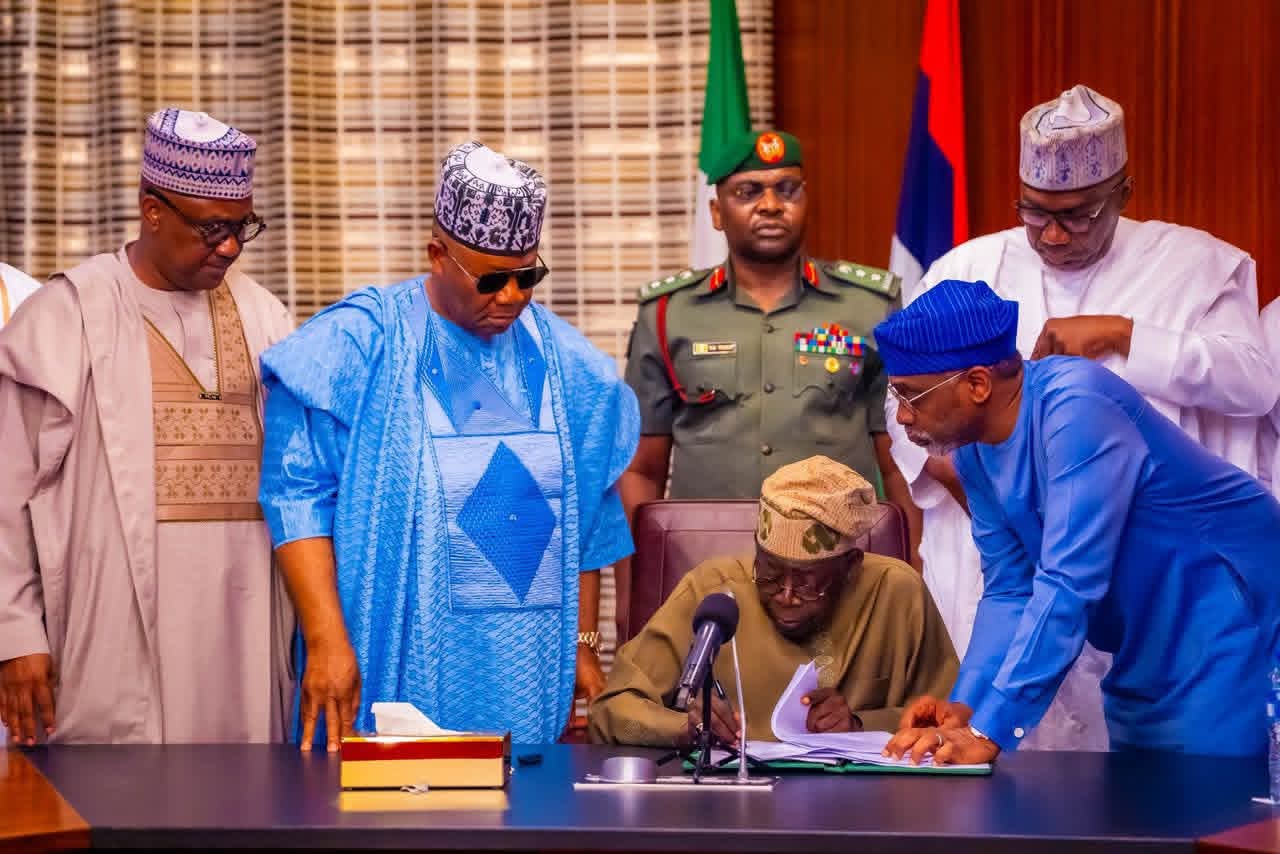 President Tinubu signing the new Tax Law