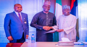 R-L: President Bola Ahmed Tinubu, Mr.Taiwo Oyedele, Chairman of the Presidential Committee on Fiscal Policy and Tax Reforms, Submitting the Committee's Report to the President, with Mr. Zacch , FIRS Executive Chairman of FIRS, in the State House Recently