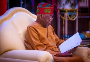 President Bola Tinubu reading