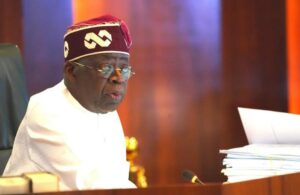 President Bola Tinubu, right