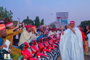 The beneficiaries cheering Governor Yusuf during the distribution