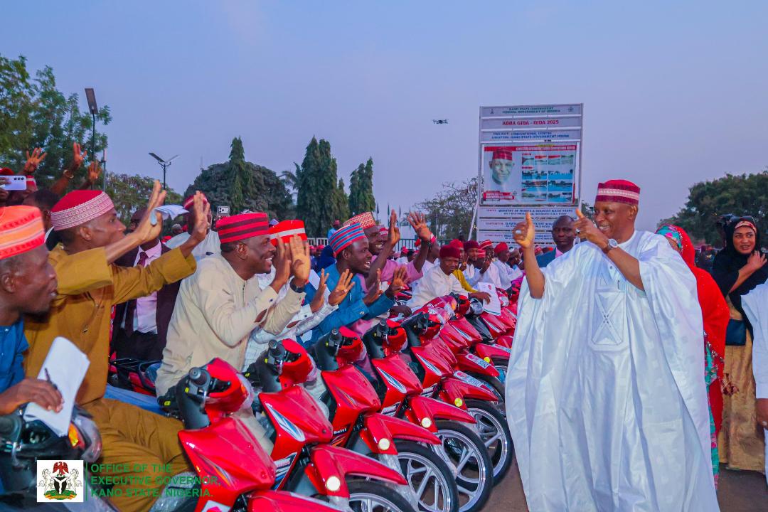 The beneficiaries cheering Governor Yusuf during the distribution